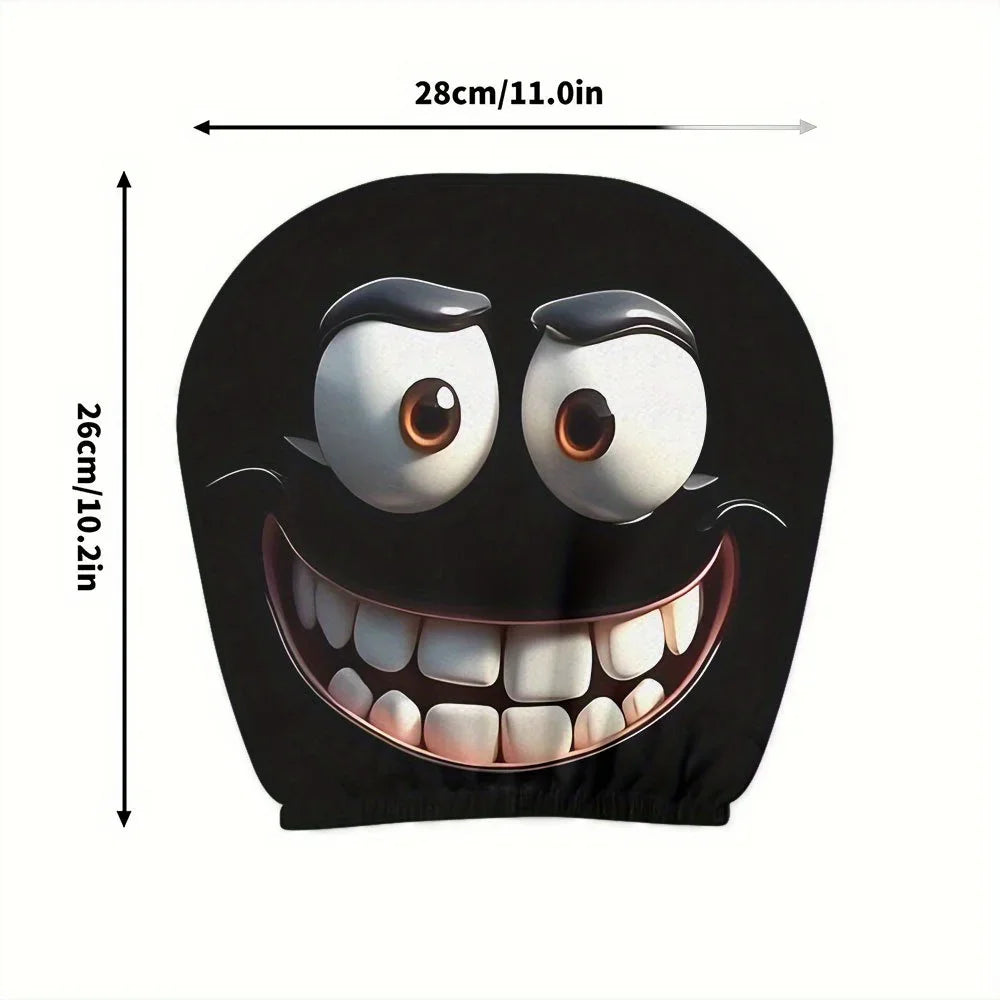 A black decorative smiley face design featuring large eyes and a wide, toothy grin on a fabric item.