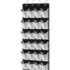 A black and white over-the-door shoe organizer with multiple hanging pockets.