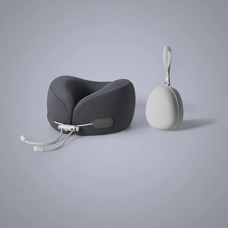 A gray U-shaped memory foam travel neck pillow with a white strap and a separate cooling cover.