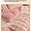 Pink plush rabbit hair bedding set showing a soft, fluffy texture and warm color.