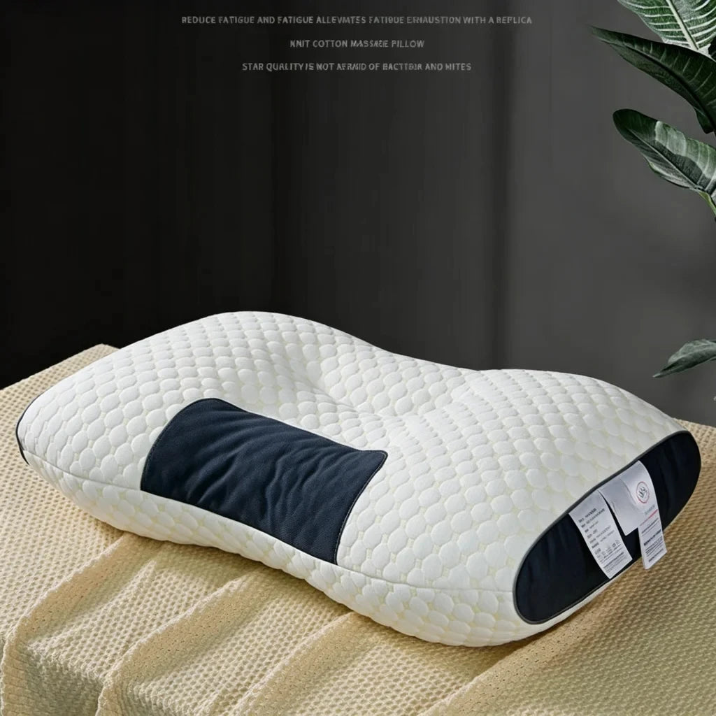 A white ergonomic contour neck pillow with a dark blue accent is resting on a beige textured fabric.
