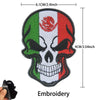Embroidery of a skull design featuring the Mexican flag and eagle motif on a black fabric patch.