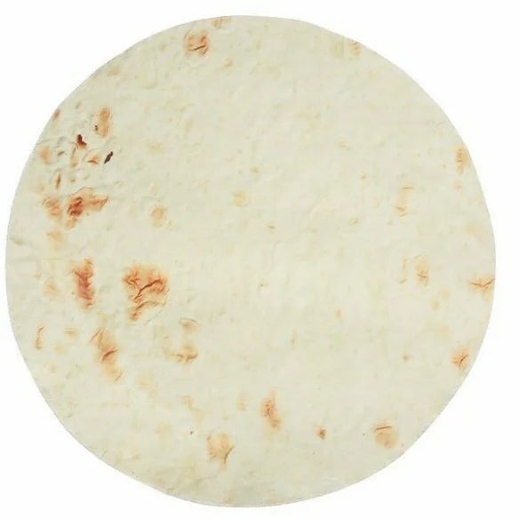 A round, light-colored tortilla or flatbread with brown spots.