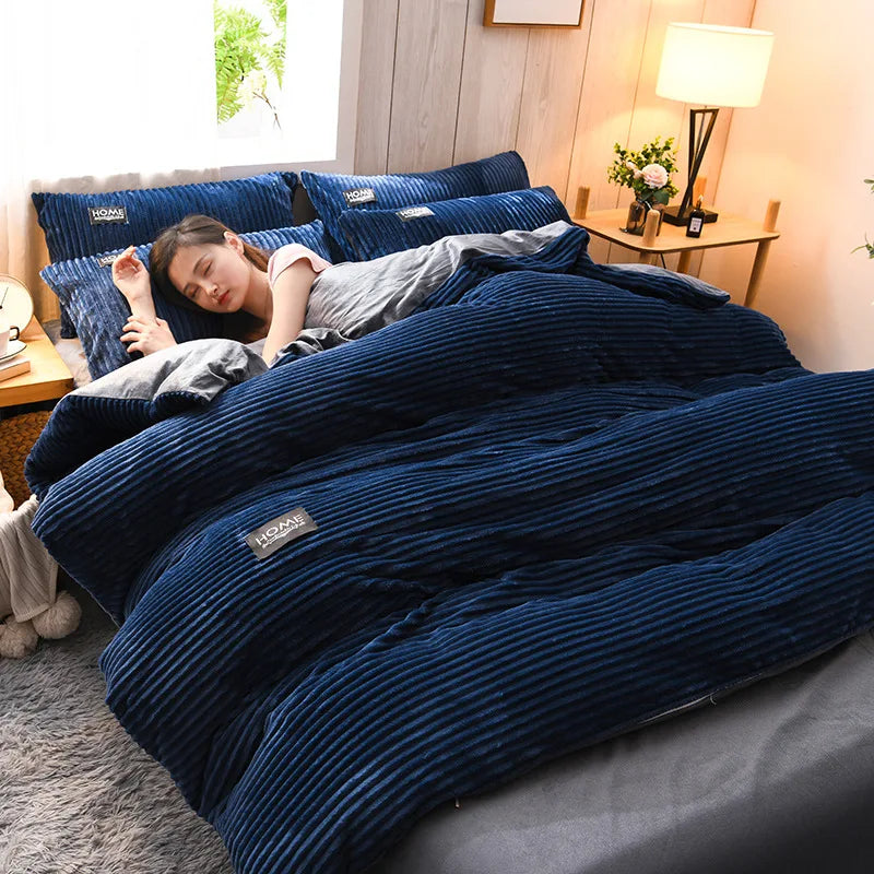 A dark blue striped duvet cover set is displayed on a bed, with a person resting under it in a bright bedroom setting.