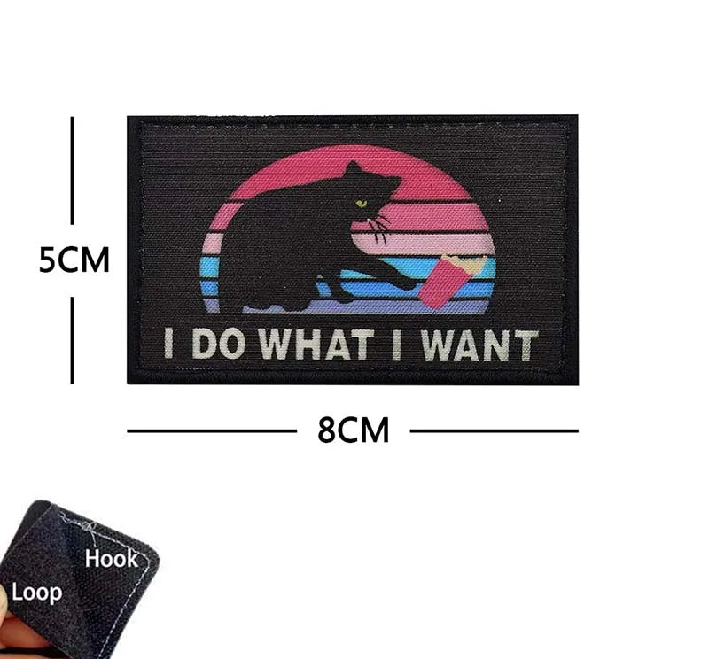 Black embroidered patch featuring a silhouette of a cat against a sunset background with the text I DO WHAT I WANT
