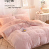 A pink plush mink velvet duvet set displayed on a bed with soft lighting and decorative elements.