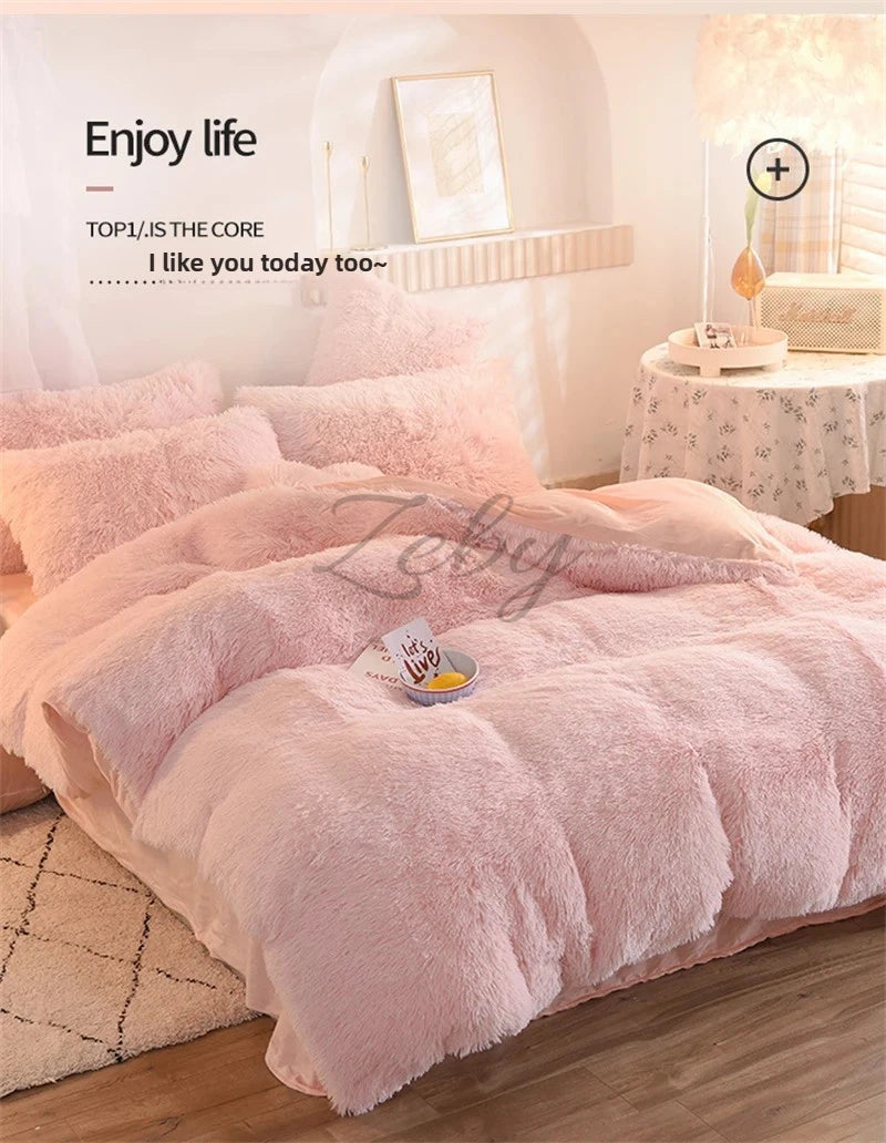 A pink plush mink velvet duvet set displayed on a bed with soft lighting and decorative elements.