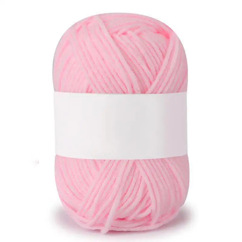 Pink soft milk cotton knitting yarn in a ball