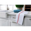 A set of white kitchen cleaning cloths with red stripes placed on a white countertop next to a sink and blue plates.