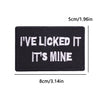 Black iron-on embroidery patch with white text that reads I'VE LICKED IT IT'S MINE