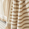 Close-up of a beige and tan striped plush chenille sofa cover fabric.