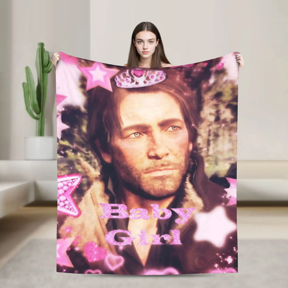 A pink and purple patterned flannel throw blanket featuring a portrait of a man labeled Baby Girl