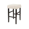 A beige upholstered bar stool with a light cream fabric slipcover and dark wood legs.