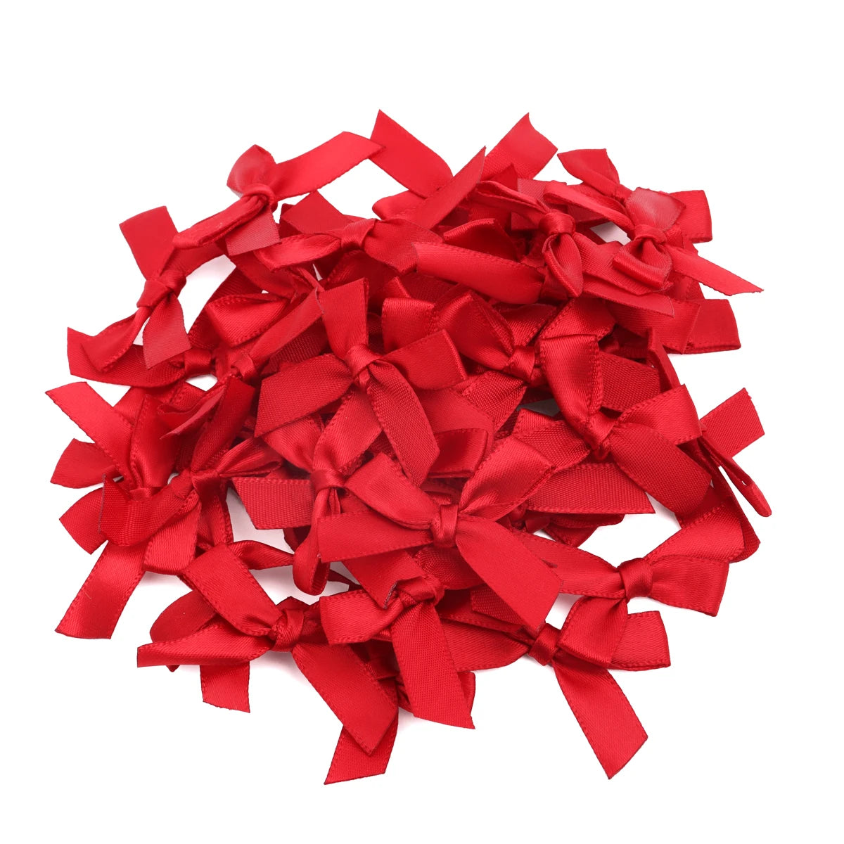 A pile of bright red satin ribbon bows for craft and decoration.