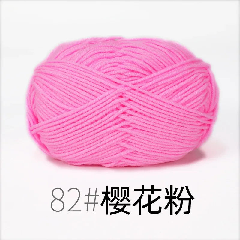 A ball of bright pink organic cotton 4ply knitting yarn for crafts.