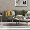 A gray linen texture wallpaper is shown on a wall, with a green sofa and wooden furniture in the foreground.