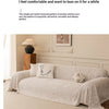 A beige herringbone chenille sofa cover draped elegantly on a light-colored sofa.