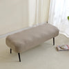 A beige elastic jacquard bench cover used as protection for a piano, dining, or entryway seat.