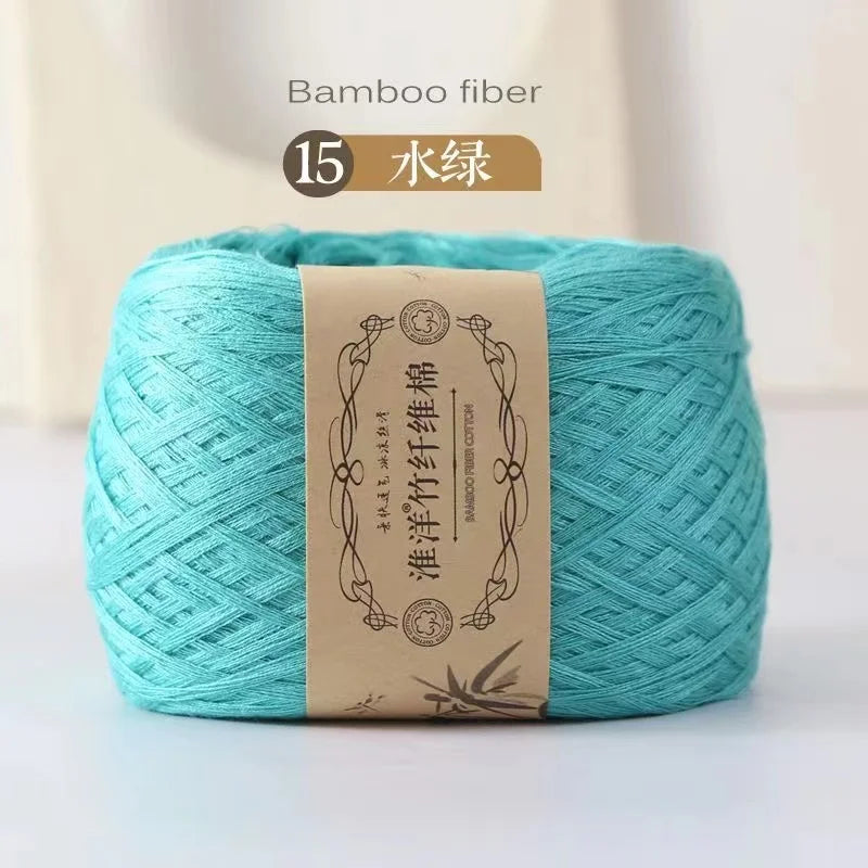 A skein of light turquoise bamboo fiber yarn labeled for crafting