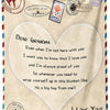A beige knit blanket featuring a heart design and text expressing love and pride for a grandma