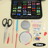 A comprehensive sewing kit featuring various needles, scissors, pins, and tools laid out on a light background.