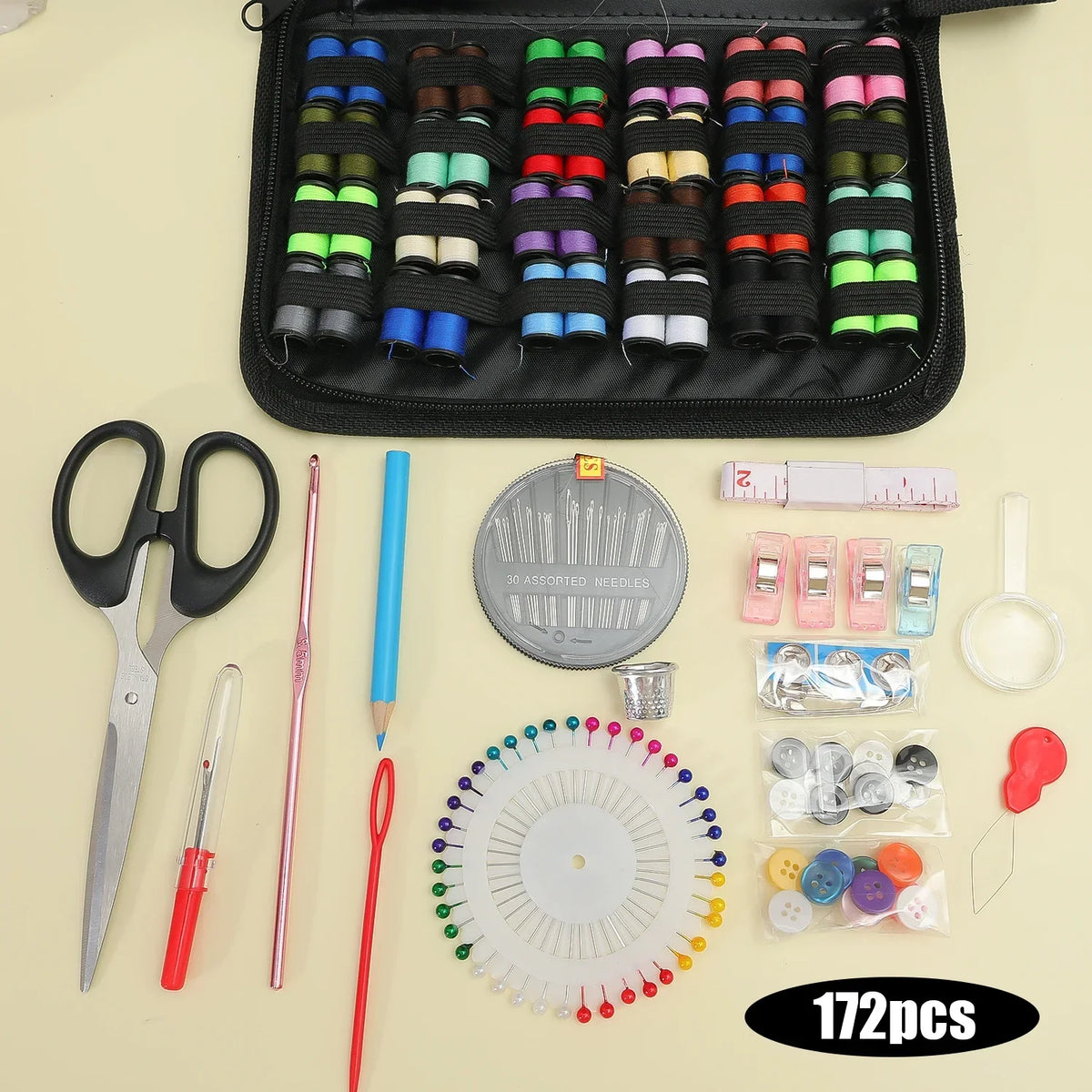 A comprehensive sewing kit featuring various needles, scissors, pins, and tools laid out on a light background.