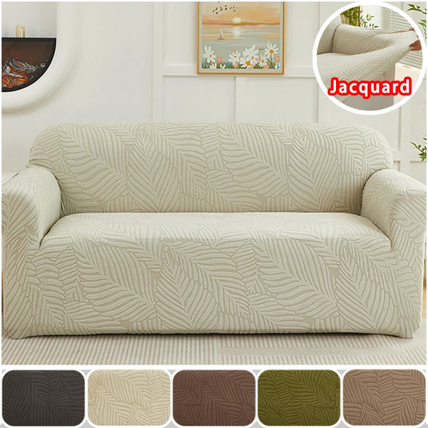 A beige sofa slipcover featuring a woven jacquard leaf pattern on a light-colored wall.
