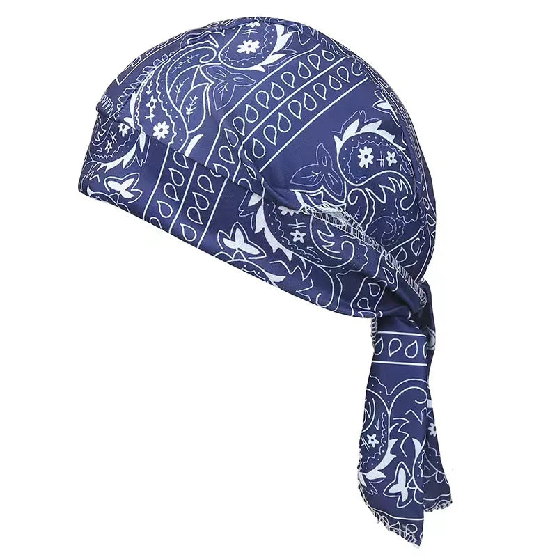 A navy blue paisley print unisex headwrap folded and displayed against a white background.