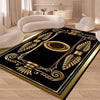 A black and gold geometric area rug with ornate patterns placed on a light wooden floor.