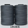 Two spools of gray hand knitting and crochet cord for crafting