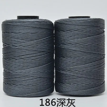 Two spools of gray hand knitting and crochet cord for crafting
