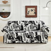 A black and white patterned stretch floral elastic sofa cover displayed on a light-colored floor.
