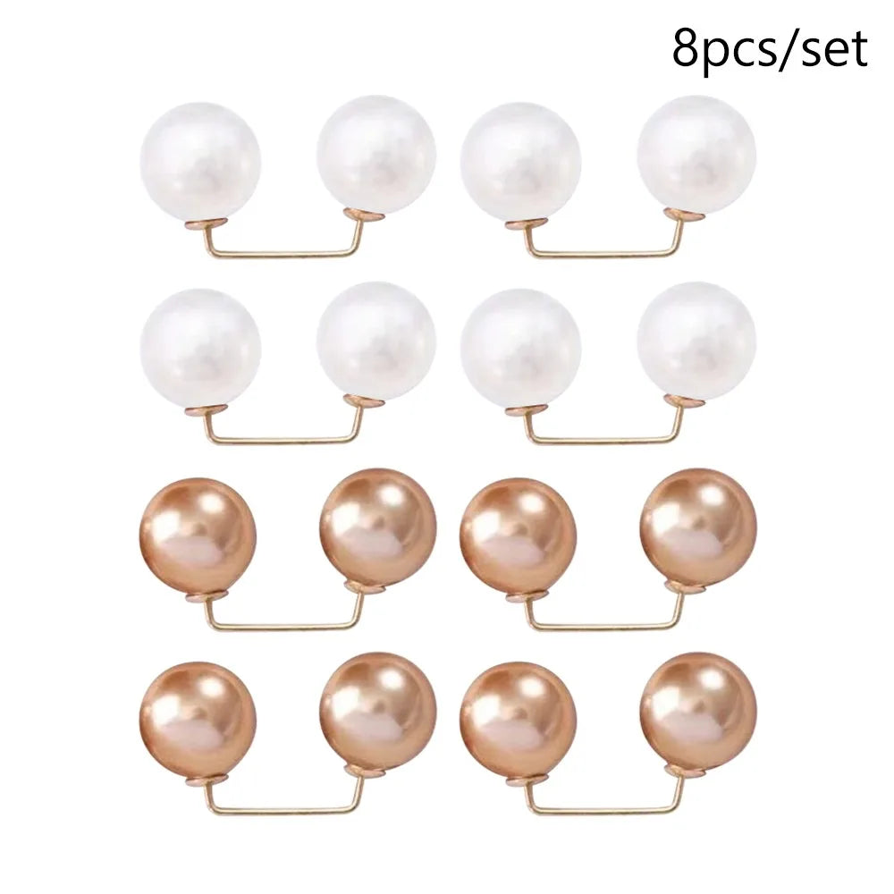 A set of eight pearl-like round jewelry pieces with gold-toned findings.