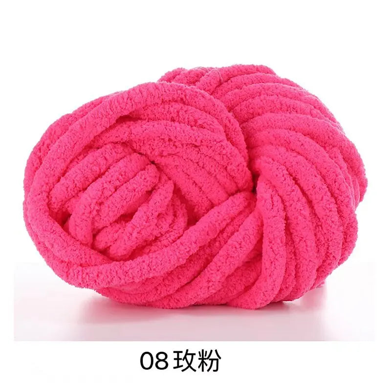 A ball of bright pink chunky acrylic yarn used for knitting and crochet projects.
