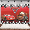 A birthday party backdrop featuring cars from Cars with a checkered pattern and a happy birthday sign.