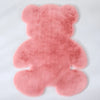 A pink plush bear-shaped non-slip area rug.