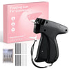 A black handheld tagging gun for clothing with a box and various needle attachments shown.