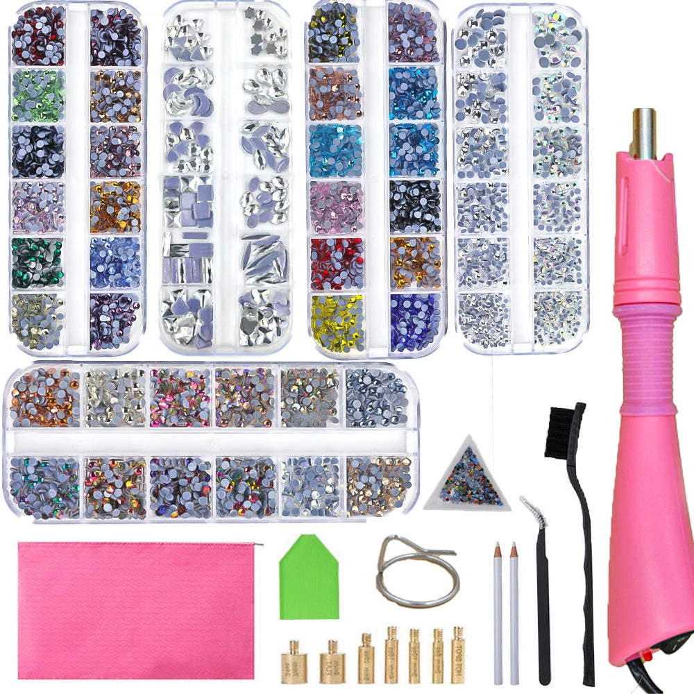 A collection of crystal hot fix rhinestones and an applicator tool displayed in various compartments.