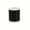 A spool of black invisible nylon sewing thread with a white core and plastic bobbin visible.
