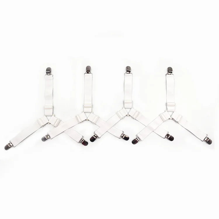 A set of adjustable sheet corner grippers with elastic straps shown against a white background.