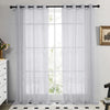White sheer tulle window curtains hanging in a window frame with a black rod and gathered fabric.