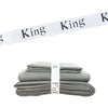 A stack of gray bed sheets rolled and secured with white King straps.