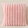 A stack of pink faux fur stripe corduroy pillow covers arranged vertically.
