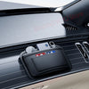 A black universal car organizer storage bag is placed on the interior panel of a car, showing a real shooting display.