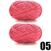 A ball of thick, bright pink velvet yarn used for knitting and crochet projects.