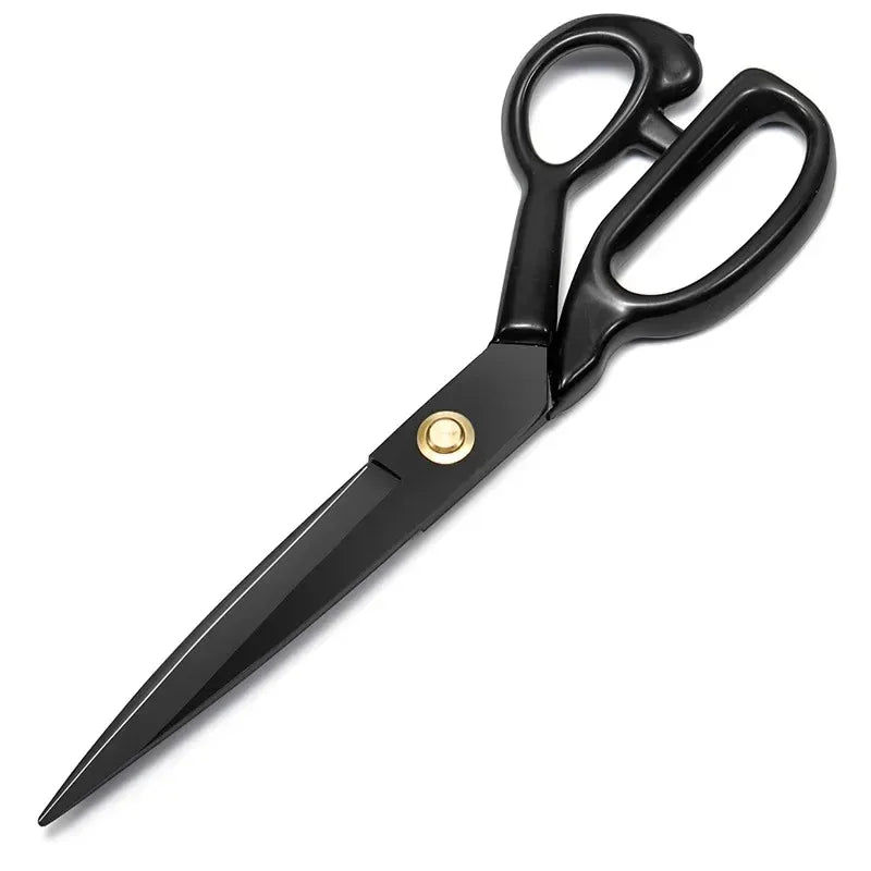 A pair of black professional heavy duty tailor scissors with gold accents for cutting leather and fabric.
