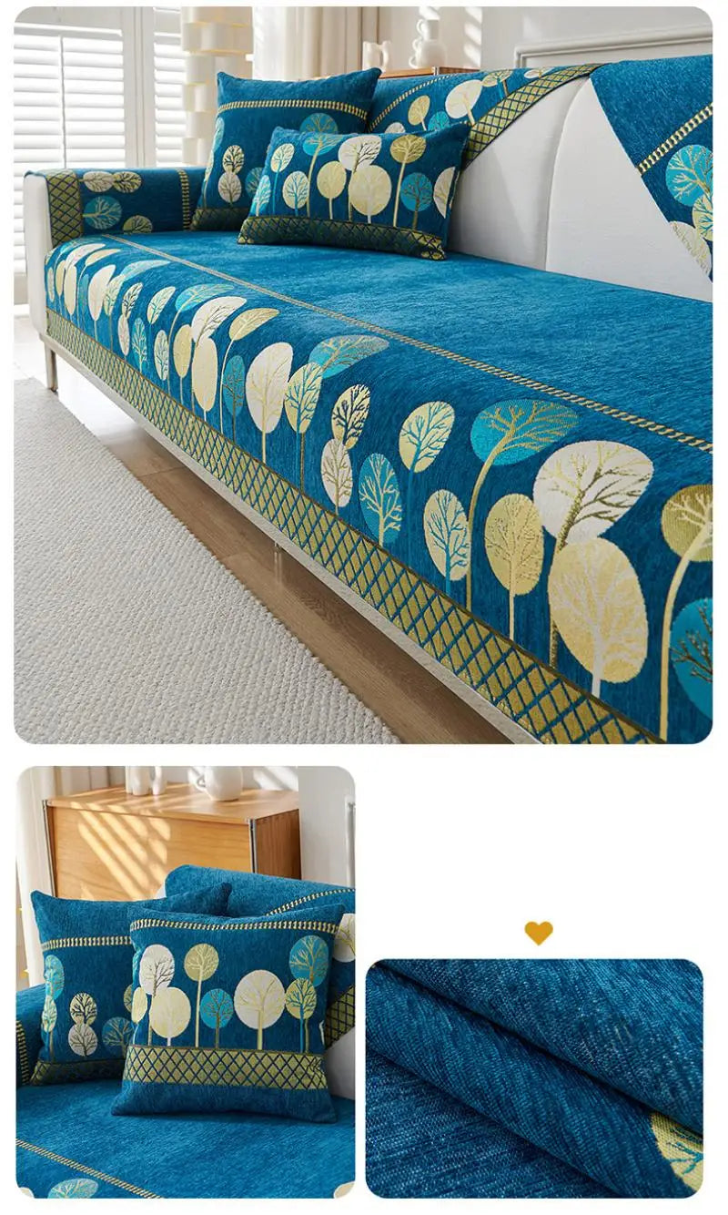 A deep blue jacquard sofa seat and back cover featuring a pattern of gold and green leaves.