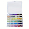 A clear plastic box containing numerous pre-wound sewing machine bobbins in various colors.