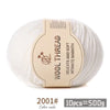 A ball of white wool thread labeled Wool Thread Delicate and Soft Intimate Warmth