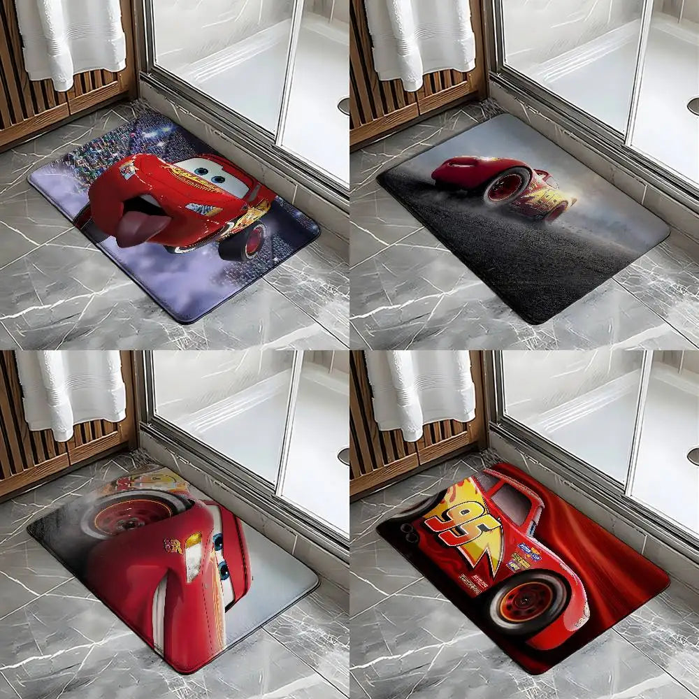 A set of cartoon anti-slip door mats featuring various red and yellow car designs placed in a wooden frame.